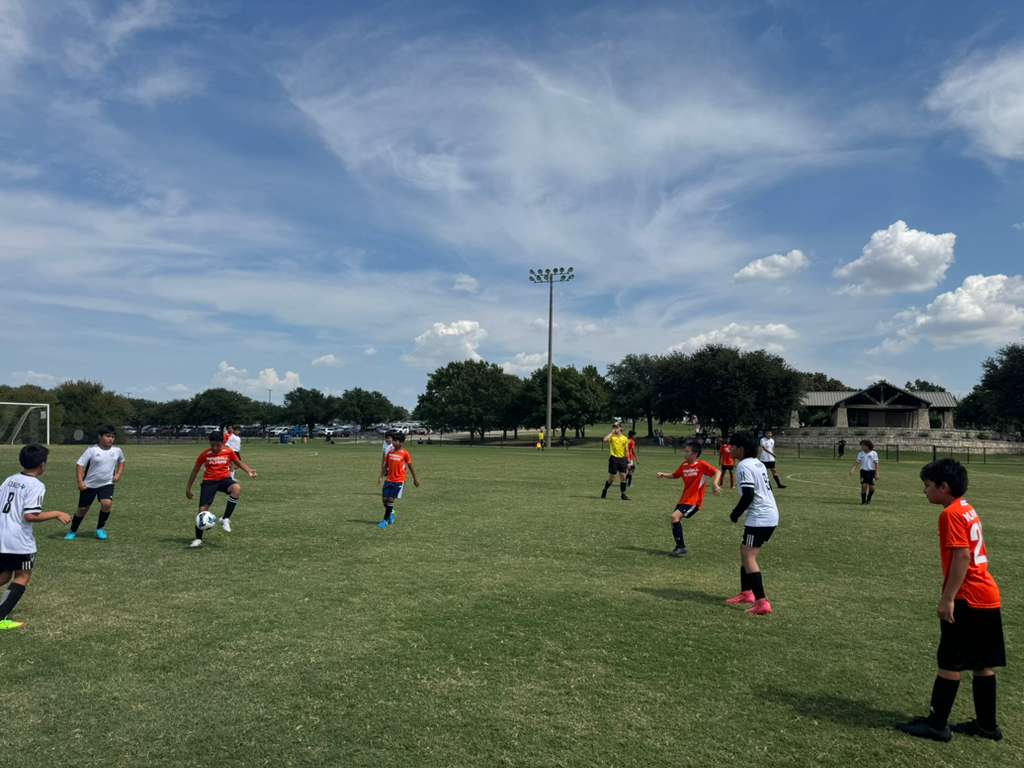 Kids competing in a football match